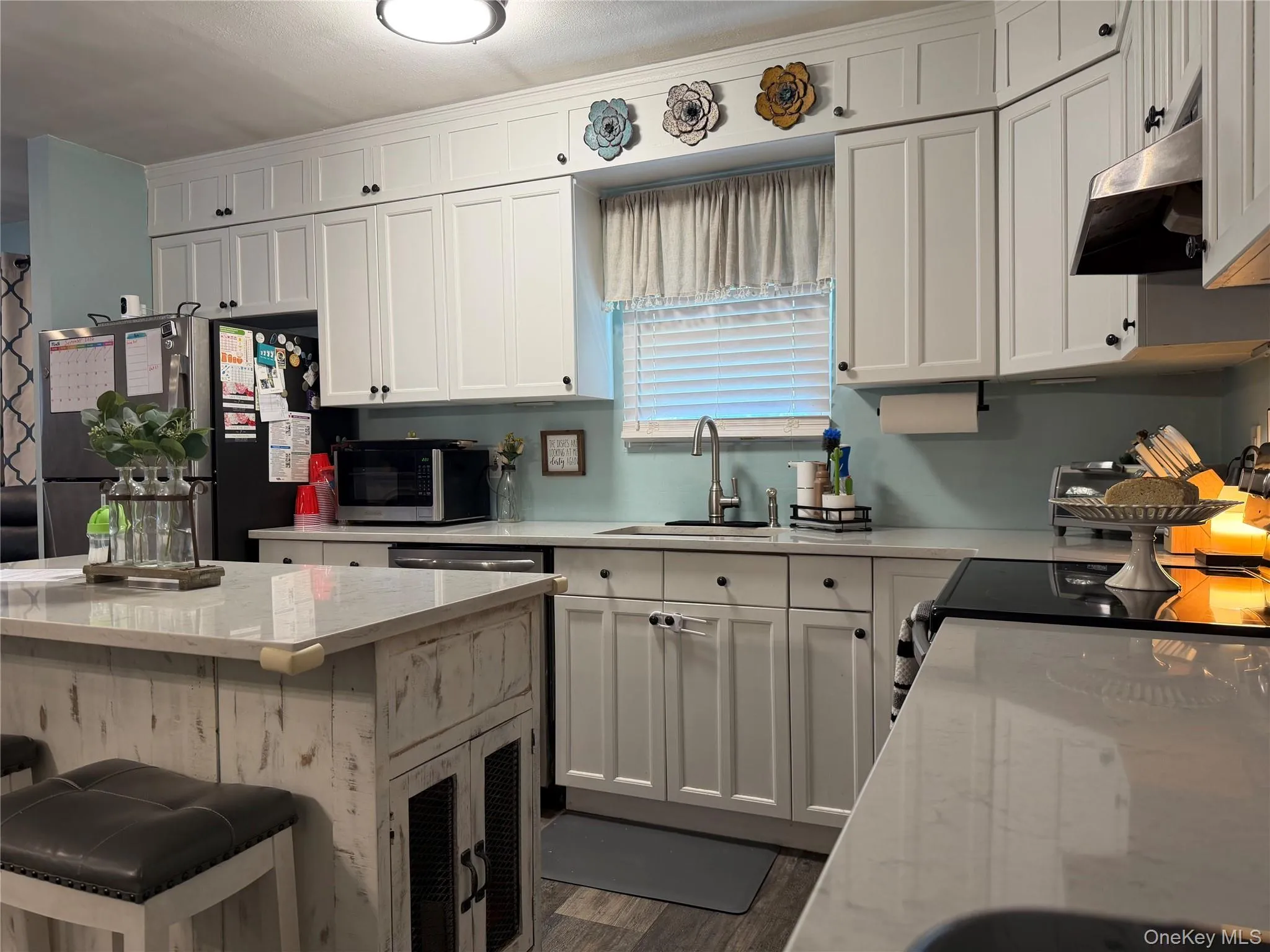 Center island is great for entertaining and provides more cabinet and counter space. Quartz counter tops Center island is great for entertaining and provides more cabinet and counter space. Quartz counter tops