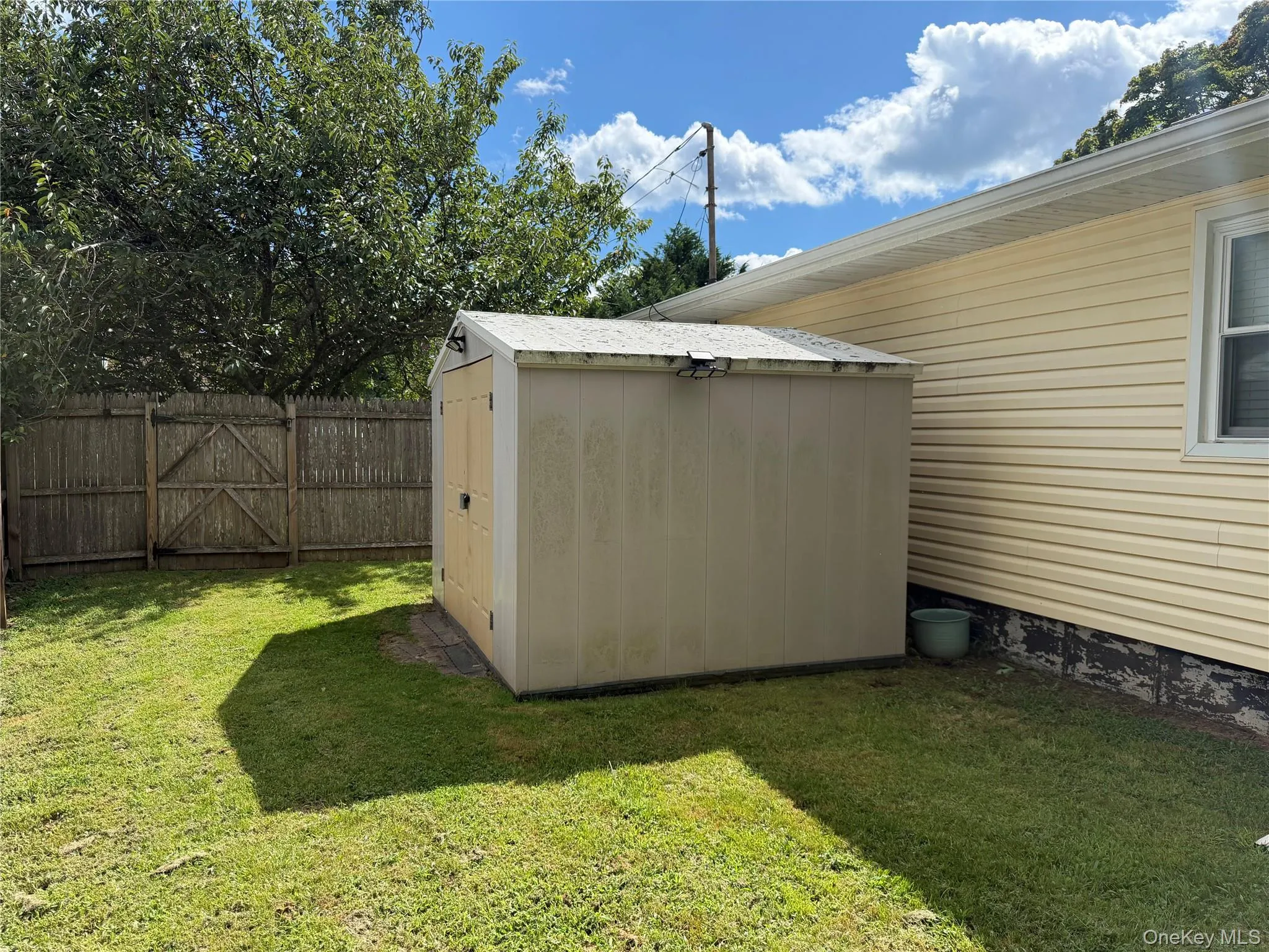 Shed in yard. Great for outdoor storage. Shed in yard. Great for outdoor storage.