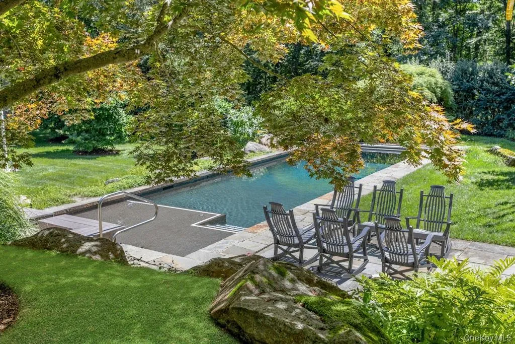 Gorgeous view of pool and patio from the pergola Gorgeous view of pool and patio from the pergola