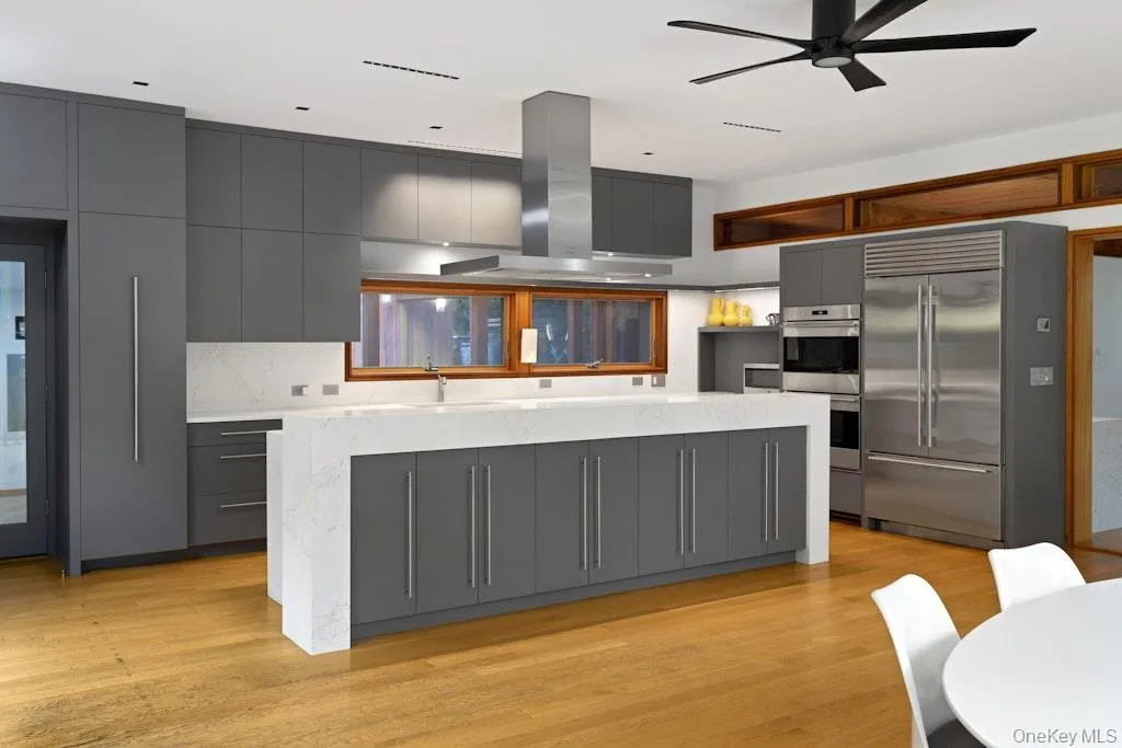 Sleek eat-in kitchen w/ Wolf, Miele and Sub-zero appliances.Quartizite counters. Sleek eat-in kitchen w/ Wolf, Miele and Sub-zero appliances.Quartizite counters.