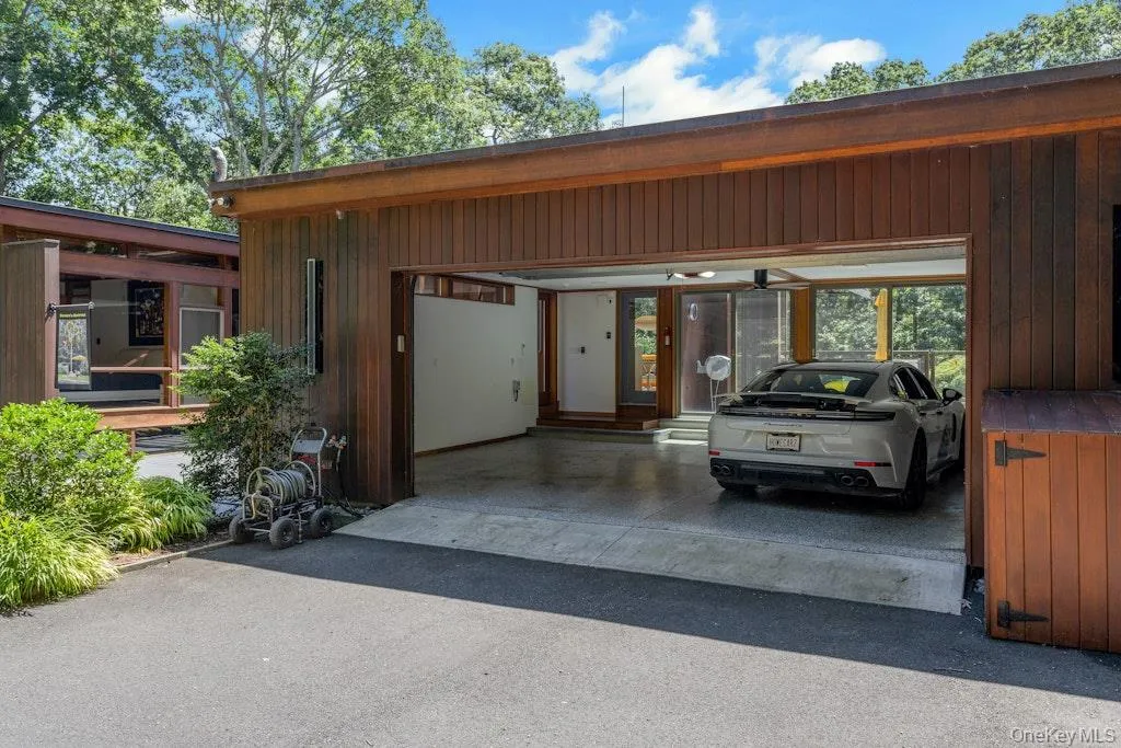 Attached - 2 Car, climate-controlled on own zone and fully digitized with two electric chargers. Attached - 2 Car, climate-controlled on own zone and fully digitized with two electric chargers.