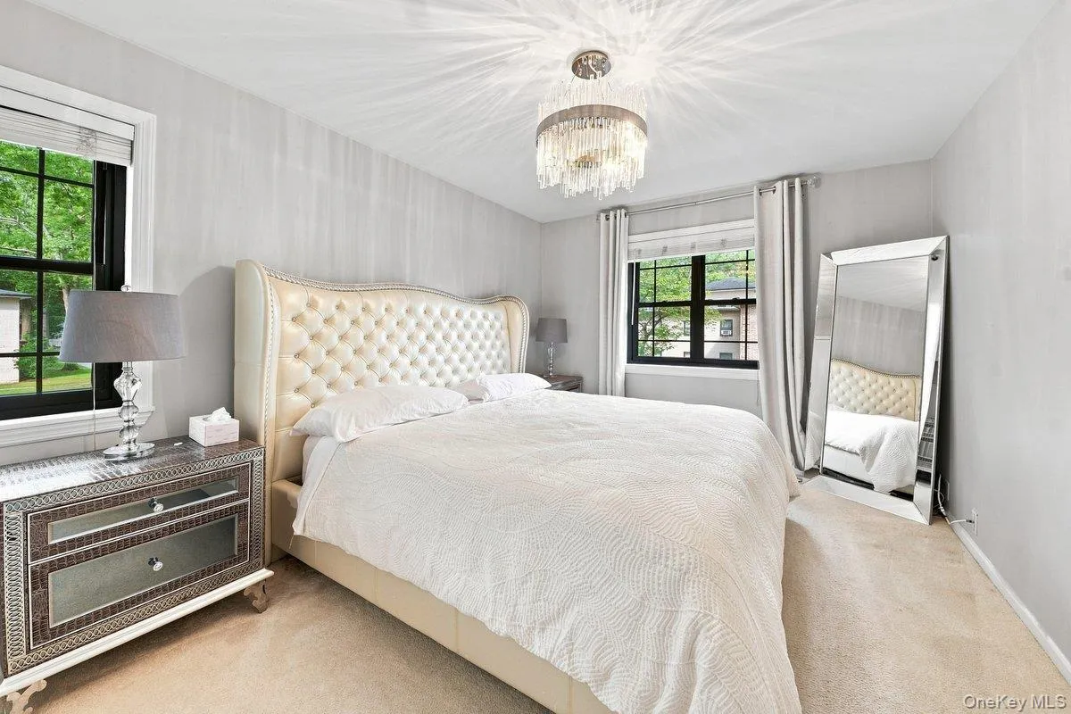 Spacious main bedroom with a double closet providing generous storage space. Spacious main bedroom with a double closet providing generous storage space.