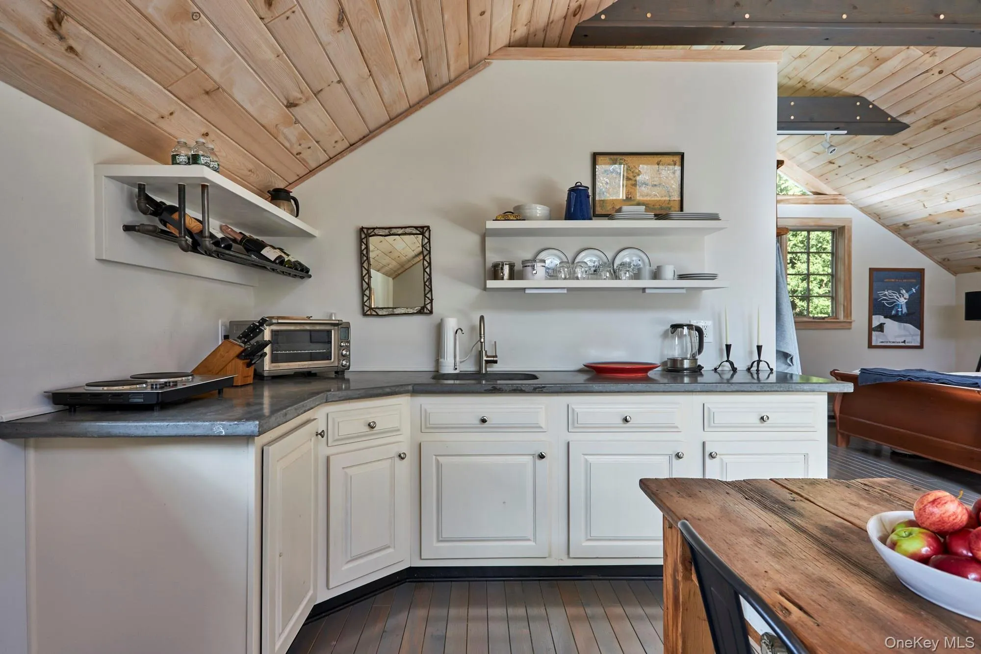 Kitchen with open shelves, wooden ceiling, white cabinets, and lofted ceiling Kitchen with open shelves, wooden ceiling, white cabinets, and lofted ceiling