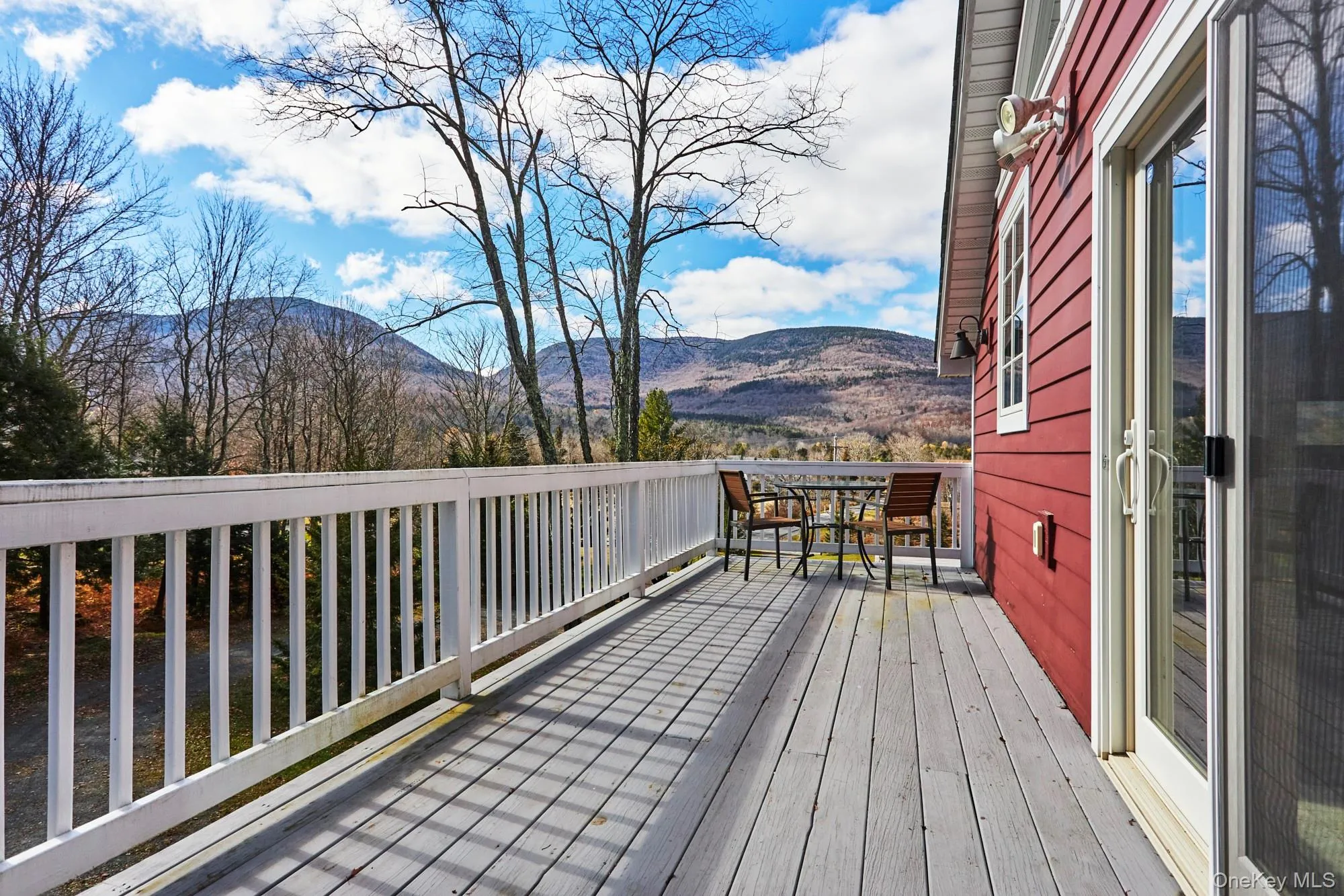 Deck featuring a mountain view Deck featuring a mountain view