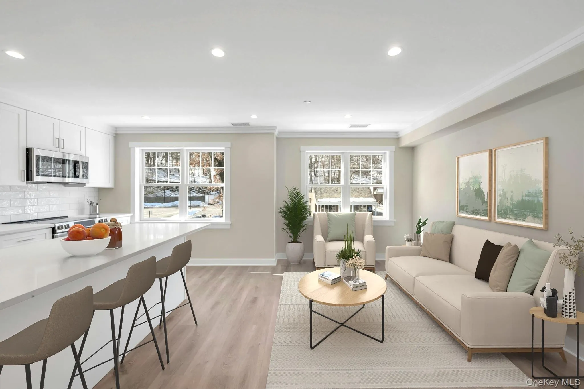 Living area featuring light wood-style floors, baseboards, crown molding, and recessed lighting Living area featuring light wood-style floors, baseboards, crown molding, and recessed lighting