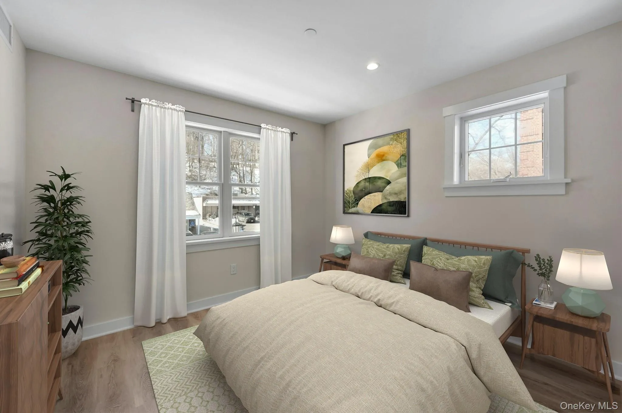 Bedroom featuring recessed lighting and light wood-style floors Bedroom featuring recessed lighting and light wood-style floors