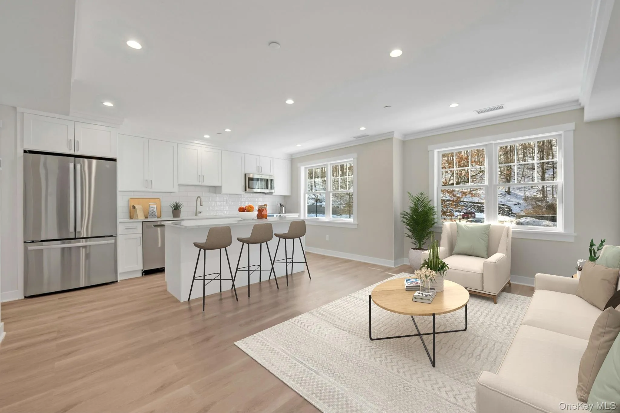 Living area featuring light wood finished floors and recessed lighting Living area featuring light wood finished floors and recessed lighting