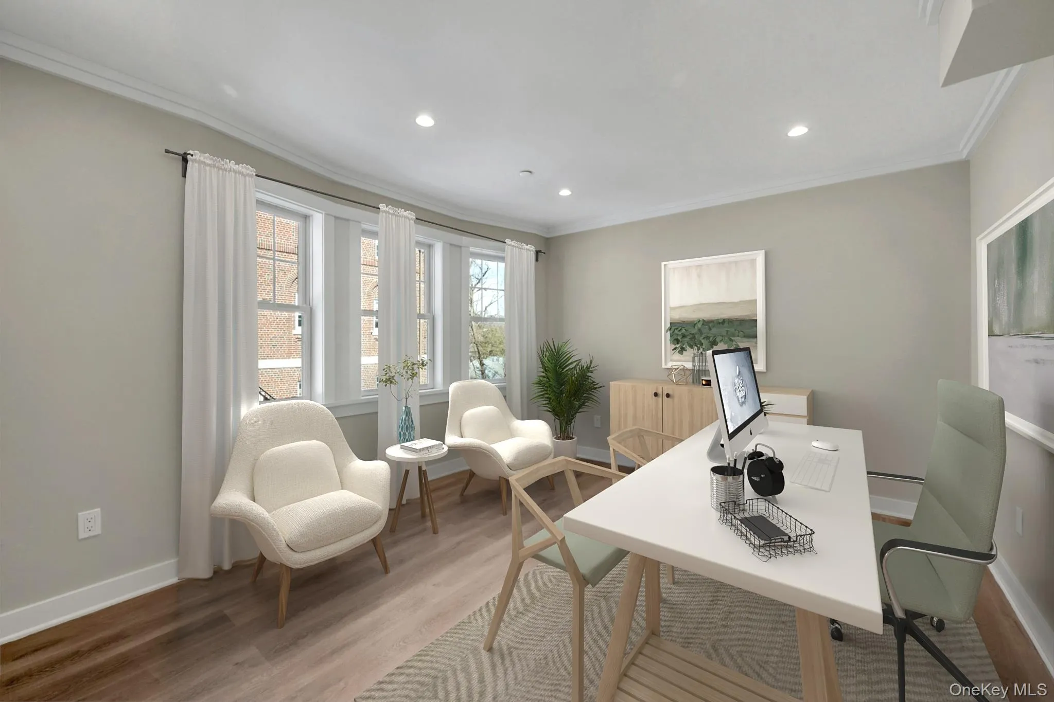 Home office featuring ornamental molding, recessed lighting, baseboards, and wood finished floors Home office featuring ornamental molding, recessed lighting, baseboards, and wood finished floors