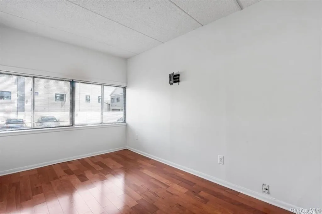 Bedroom with Hardwood-style flooring throughout Bedroom with Hardwood-style flooring throughout
