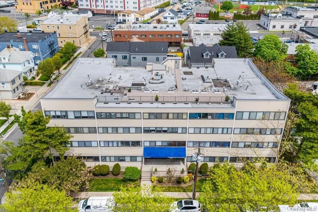 Multi-story commercial building with a flat roof and multiple windows Multi-story commercial building with a flat roof and multiple windows