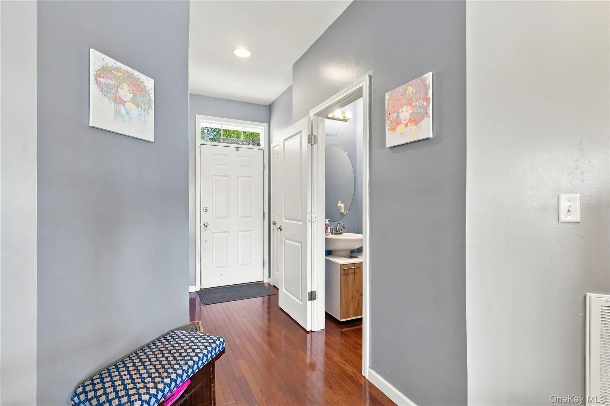 Coat closet and half bath in entryway Coat closet and half bath in entryway