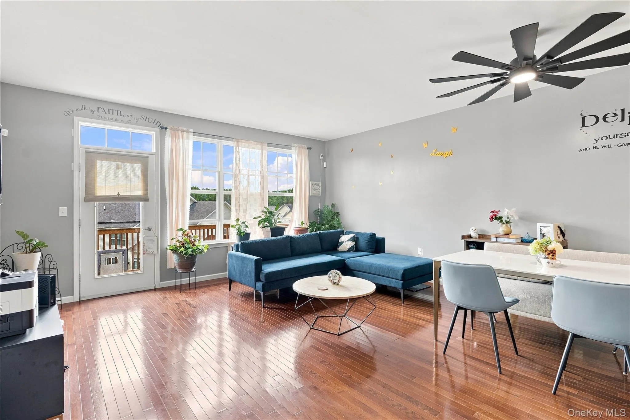 Living room with floor to ceiling windows for natural light Living room with floor to ceiling windows for natural light
