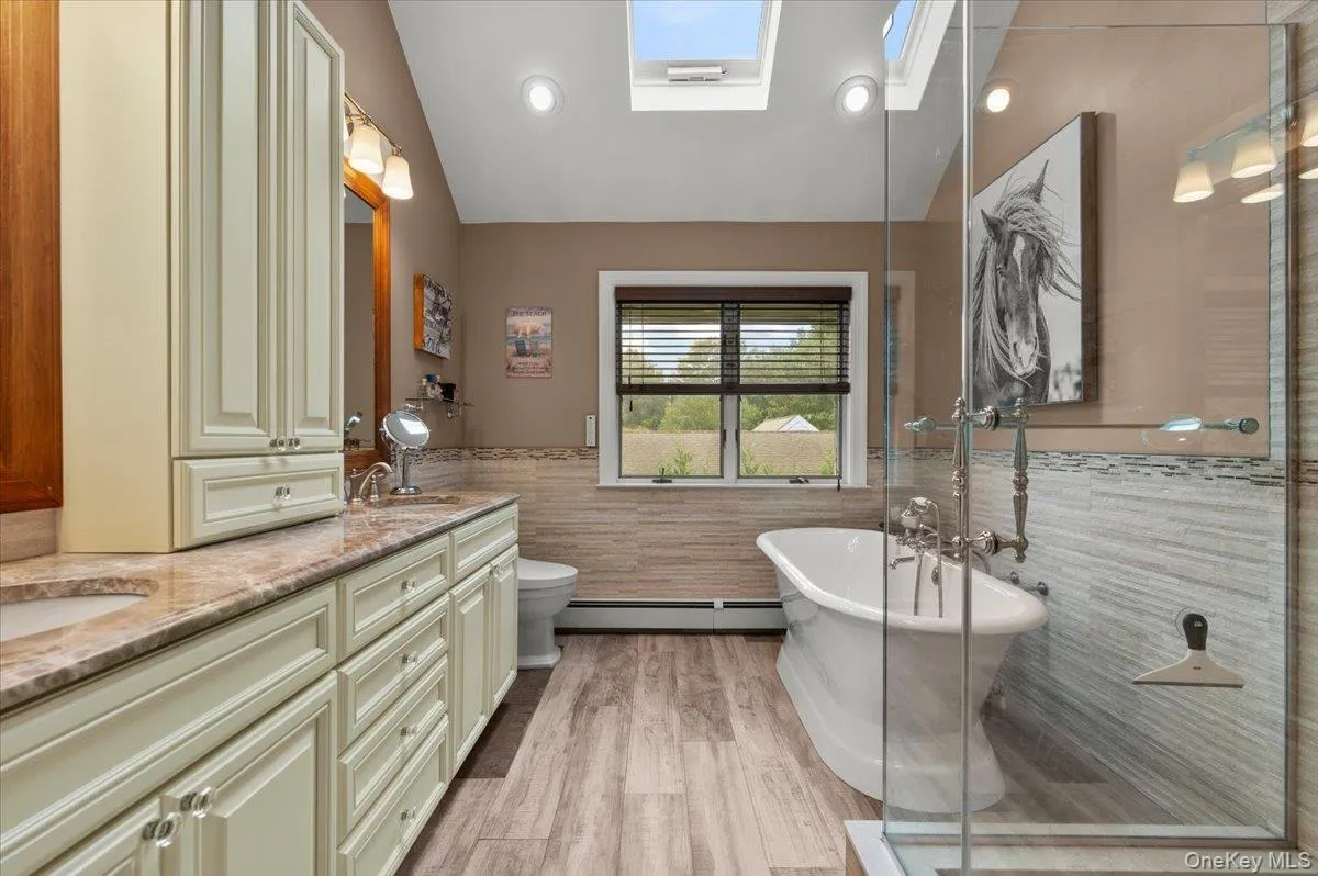Recently updated primary bathroom, including soaking tub, shower, double vanity and radiant heat Recently updated primary bathroom, including soaking tub, shower, double vanity and radiant heat