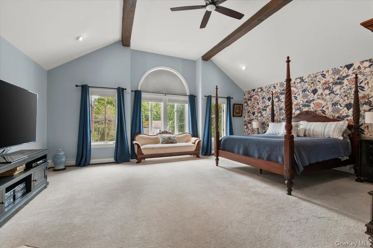Primary bedroom with cathedral ceilings Primary bedroom with cathedral ceilings