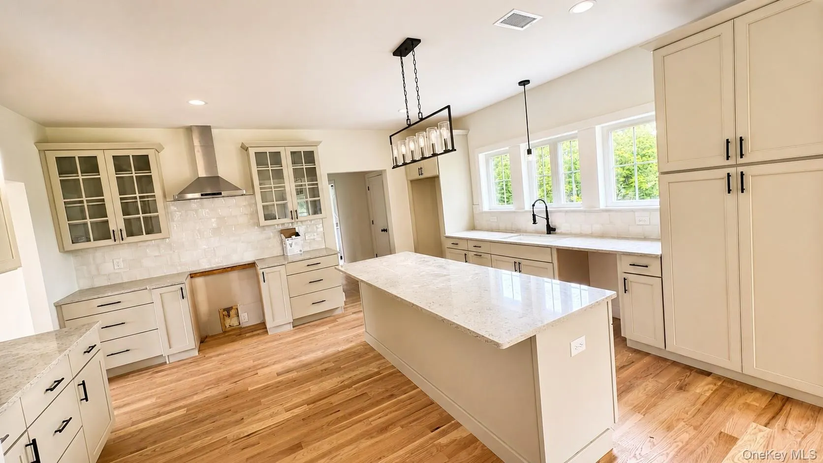 The completed spacious kitchen provides plenty of room for meal preparation while maintaining an open, welcoming feel. The completed spacious kitchen provides plenty of room for meal preparation while maintaining an open, welcoming feel.