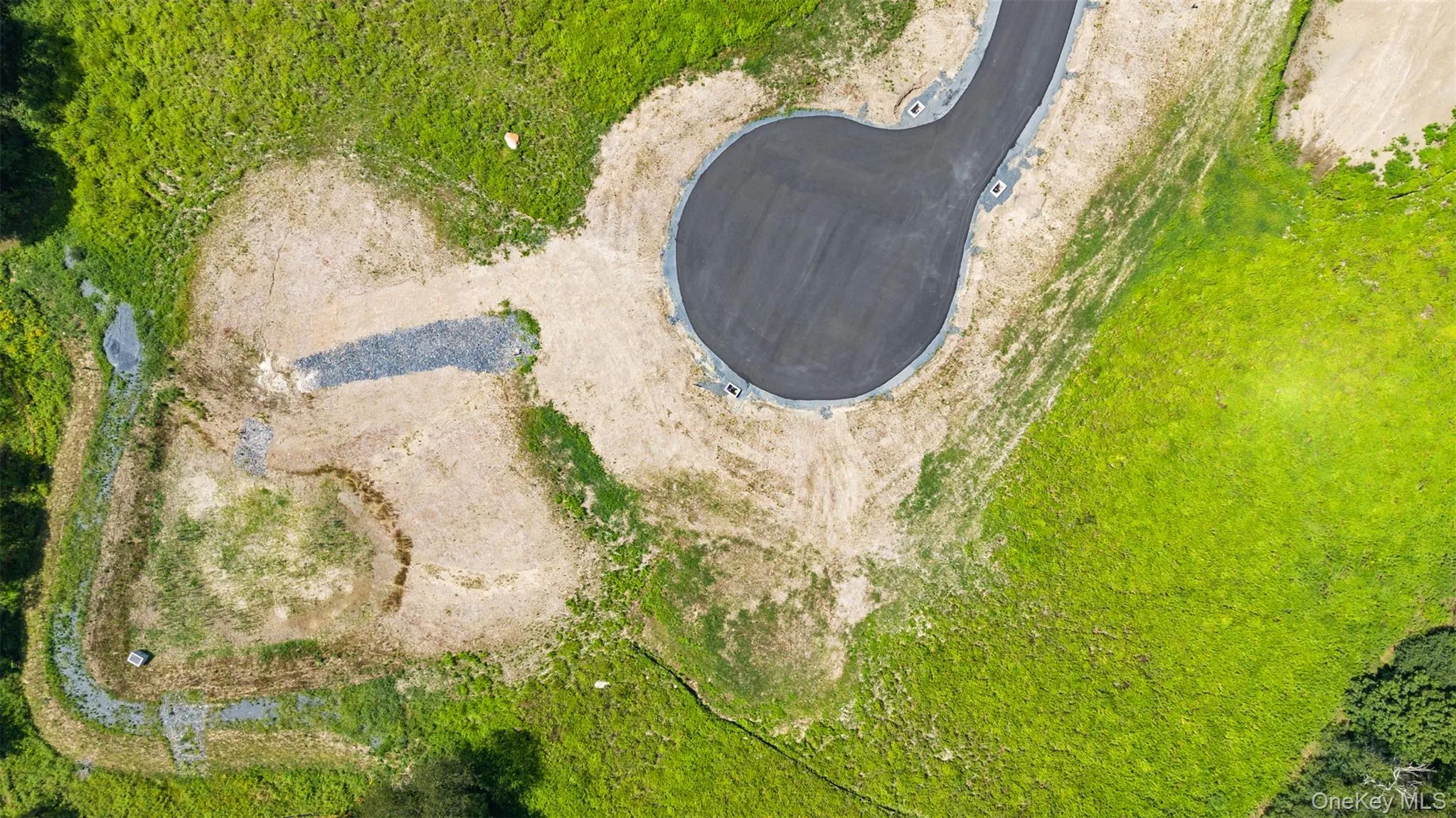Aerial view of the cul-de-sac of the subdivision. See attached Brochure & Site Maps in Document Section. Aerial view of the cul-de-sac of the subdivision. See attached Brochure & Site Maps in Document Section.