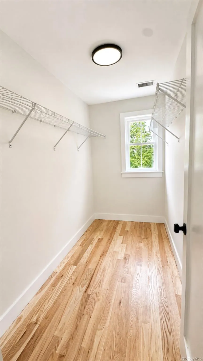 The spacious walk-in closet provides generous storage and organization options, helping keep everyday essentials neatly arranged. The spacious walk-in closet provides generous storage and organization options, helping keep everyday essentials neatly arranged.
