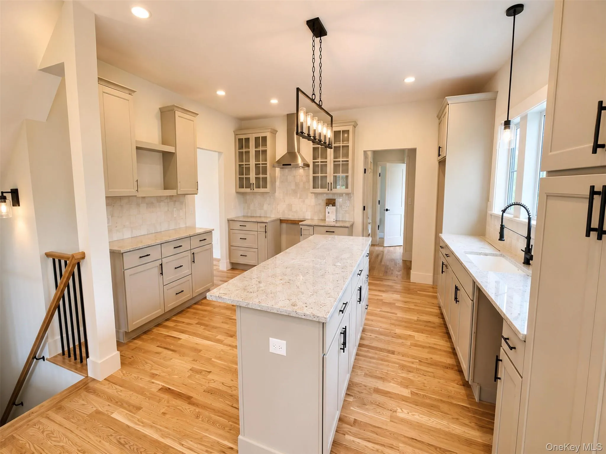 The open kitchen layout creates seamless connection to surrounding living spaces. The open kitchen layout creates seamless connection to surrounding living spaces.