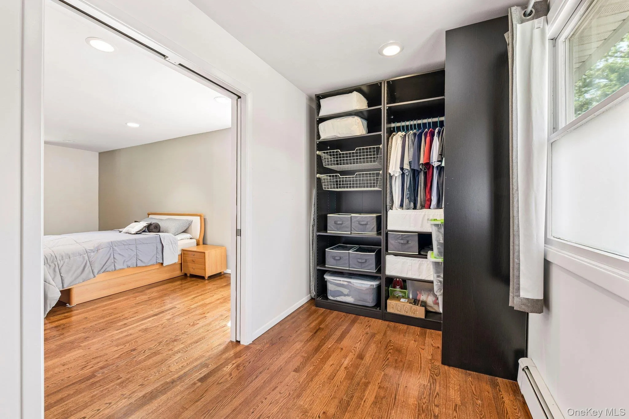 large walk in closet with high hats, heat and window to bring in natural light. large walk in closet with high hats, heat and window to bring in natural light.