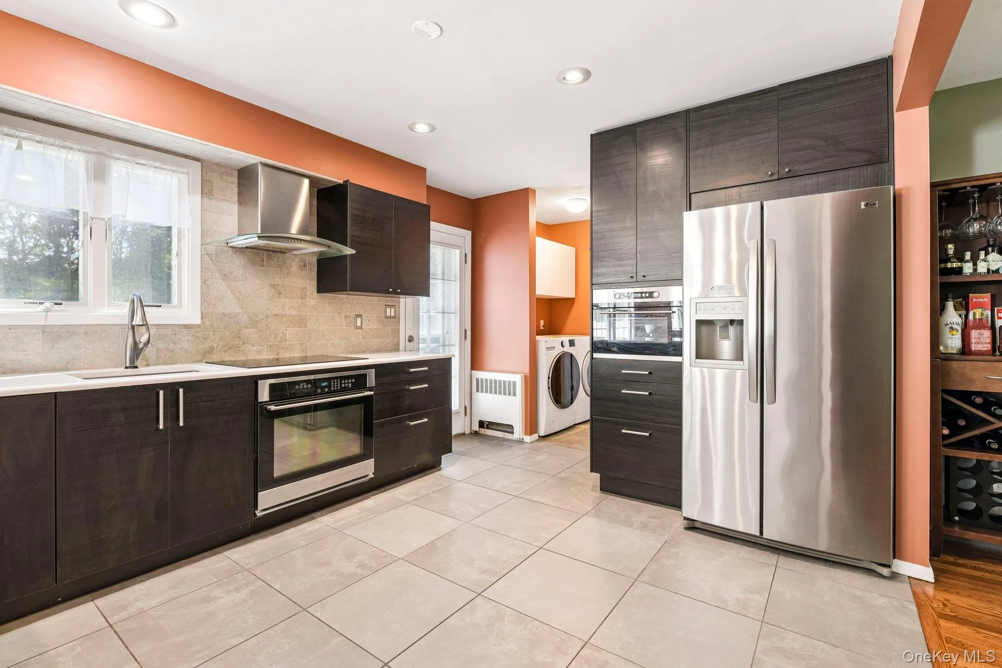 Tiled kitchen with stainless steel appliances, high hats, window and door exit to the yard. Entry into dining room and Laundry area. Tiled kitchen with stainless steel appliances, high hats, window and door exit to the yard. Entry into dining room and Laundry area.