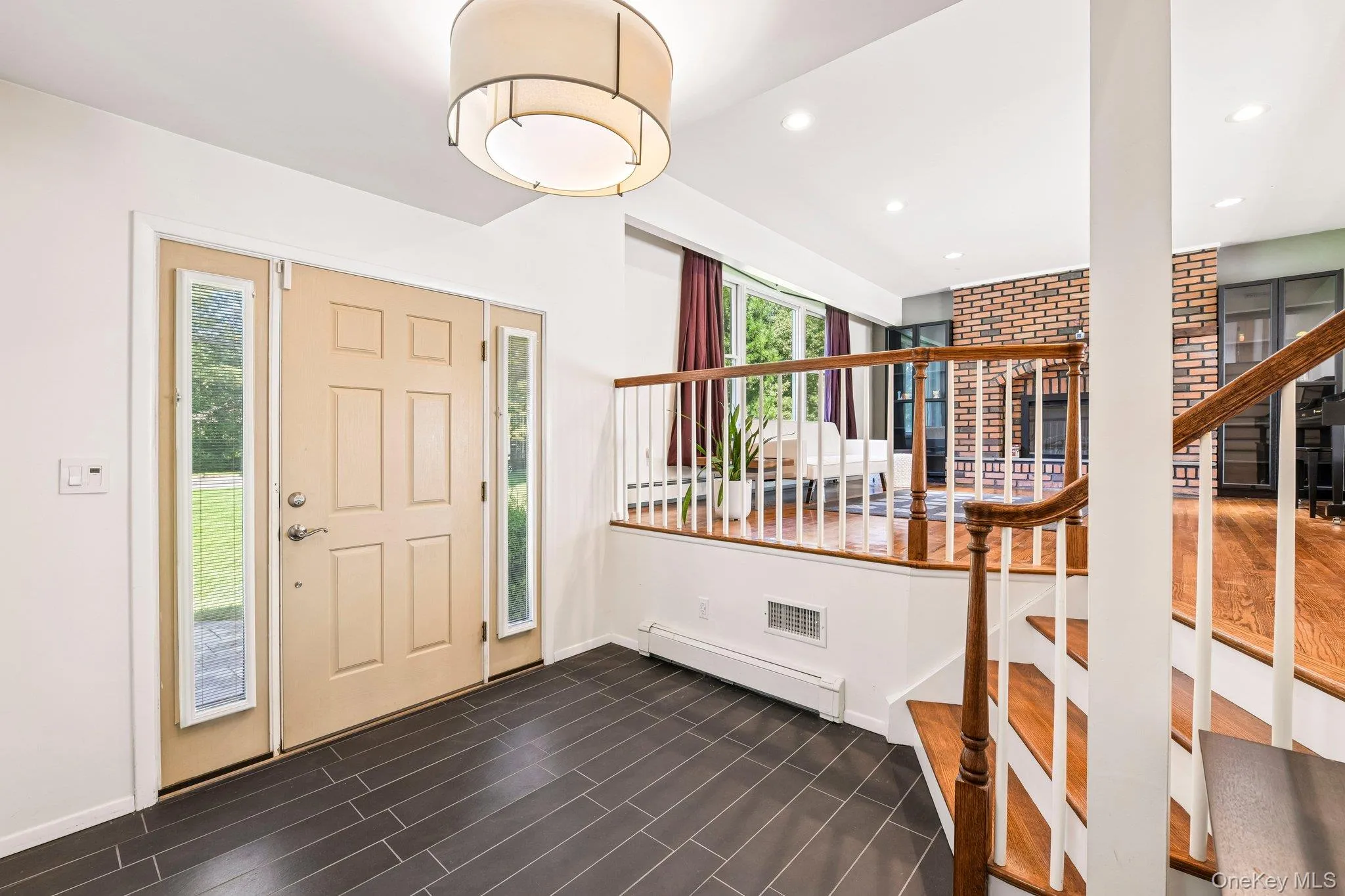 front door view, porcelain tile entrance, living room view from foyer front door view, porcelain tile entrance, living room view from foyer