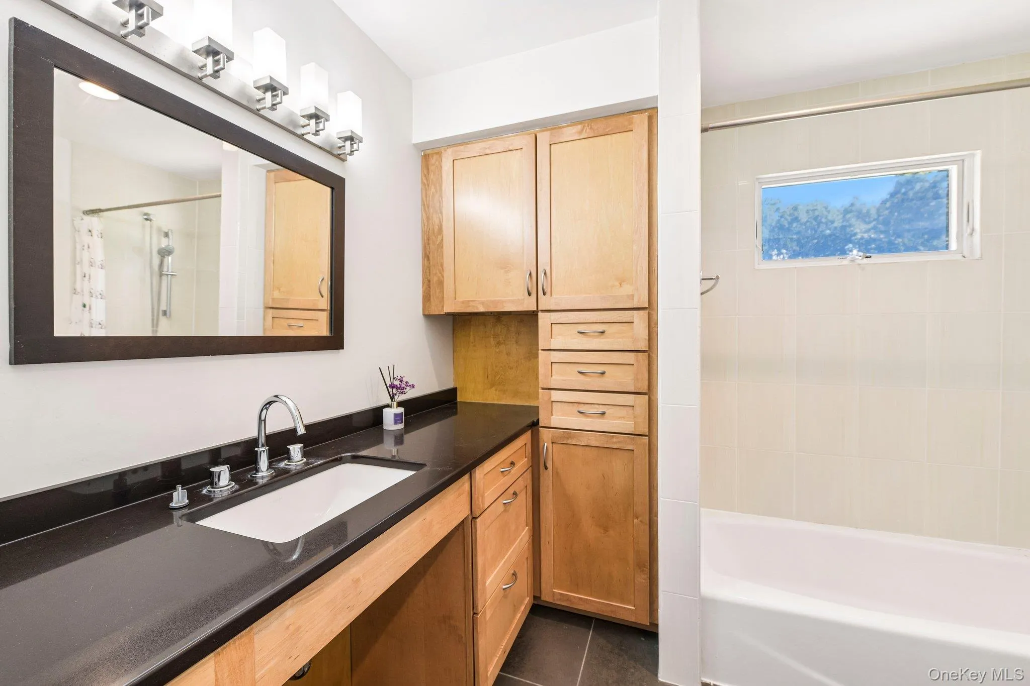 Third floor bathroom with entry from hallway. Quartz counter top, tiled radiant heated floor. Third floor bathroom with entry from hallway. Quartz counter top, tiled radiant heated floor.