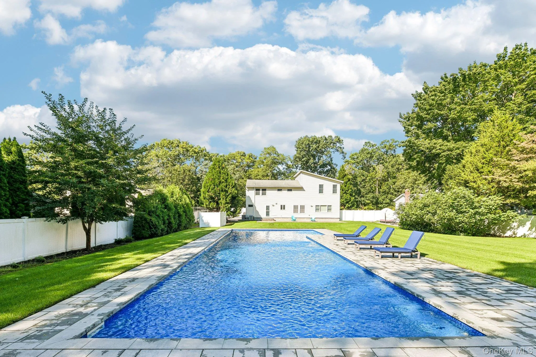 Back yard with beautiful pool, patio, and landscaping. Back yard with beautiful pool, patio, and landscaping.