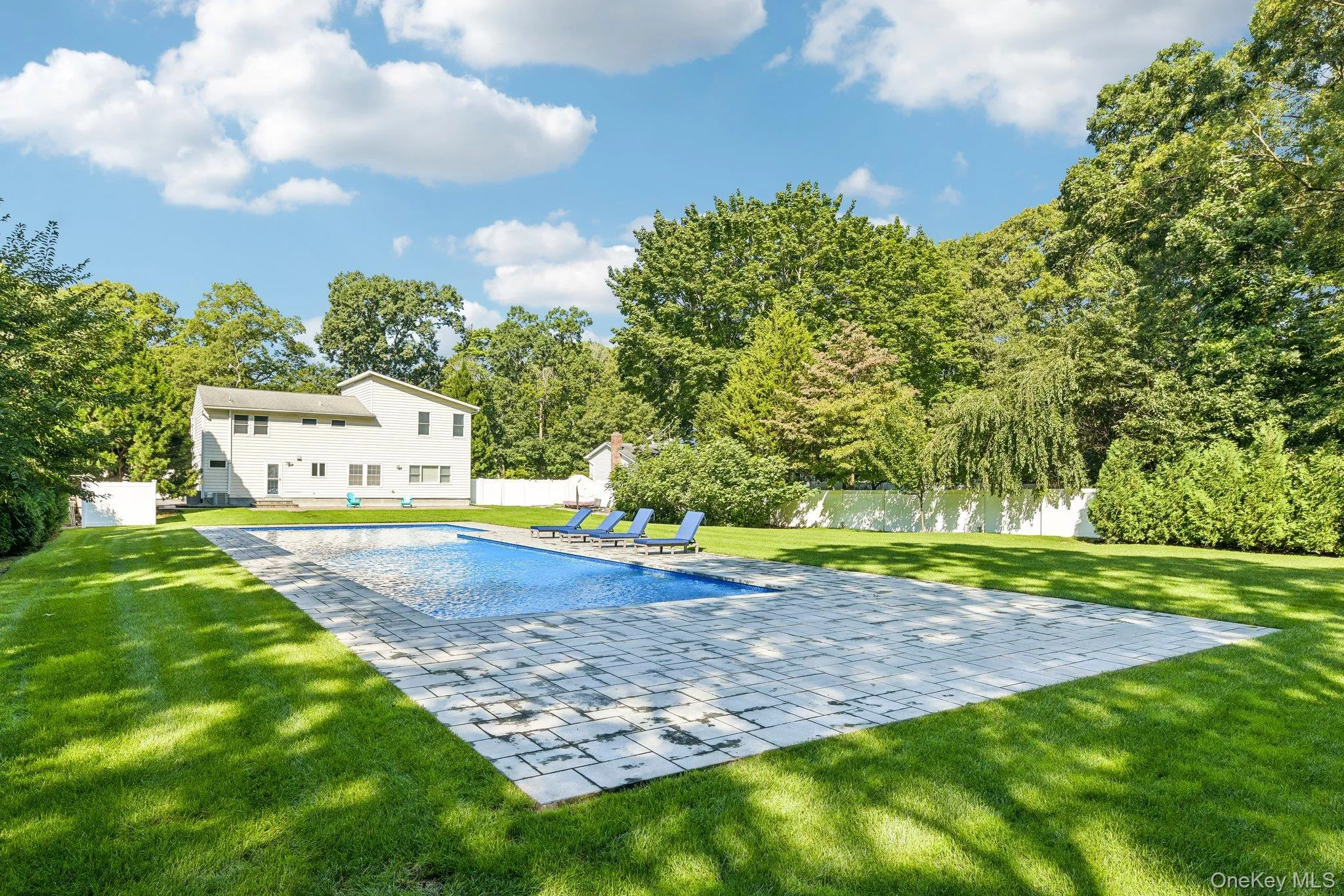 back yard, 25 yard official short course, salt water, heated pool, manicured lawn with much privacy and 1/4 wooded back property. Full yard, fenced. back yard, 25 yard official short course, salt water, heated pool, manicured lawn with much privacy and 1/4 wooded back property. Full yard, fenced.