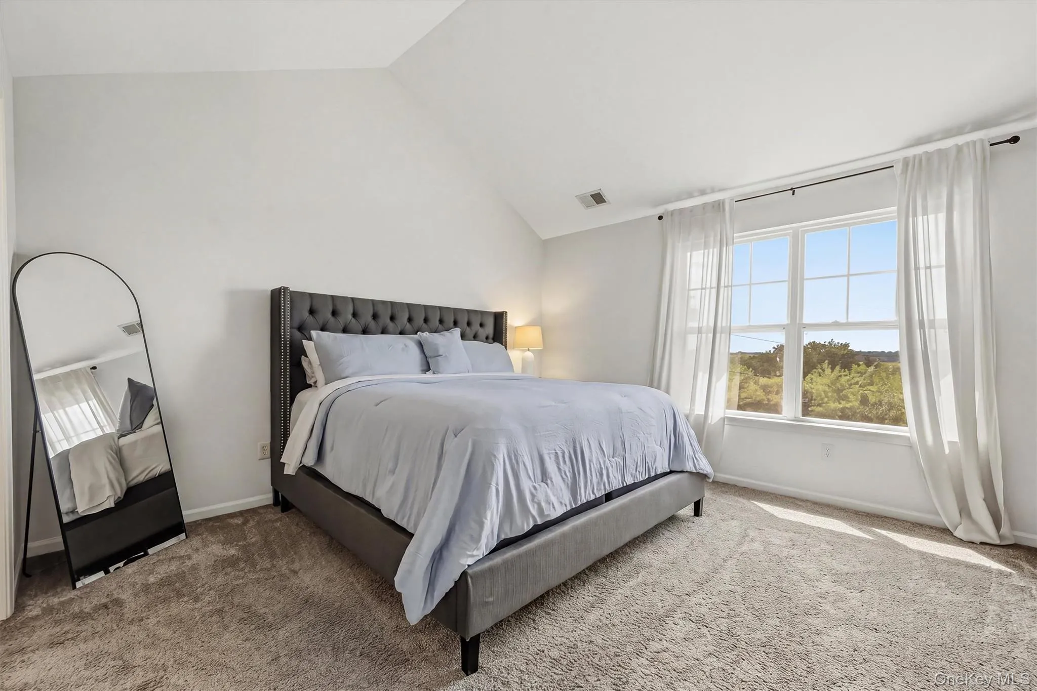 Bright & Spacious Primary Bedroom with private window view Bright & Spacious Primary Bedroom with private window view