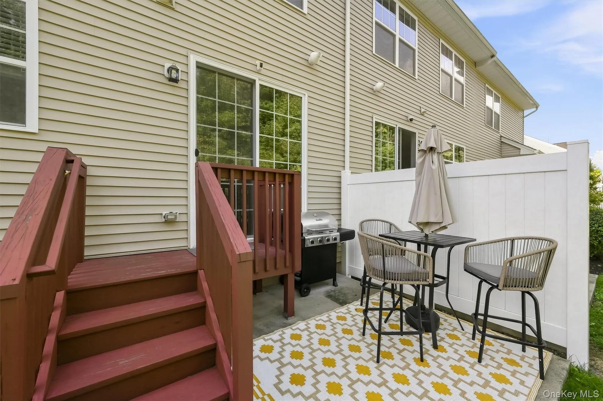 Sliding Glass Doors leading to Backyard Deck & Patio Area Sliding Glass Doors leading to Backyard Deck & Patio Area