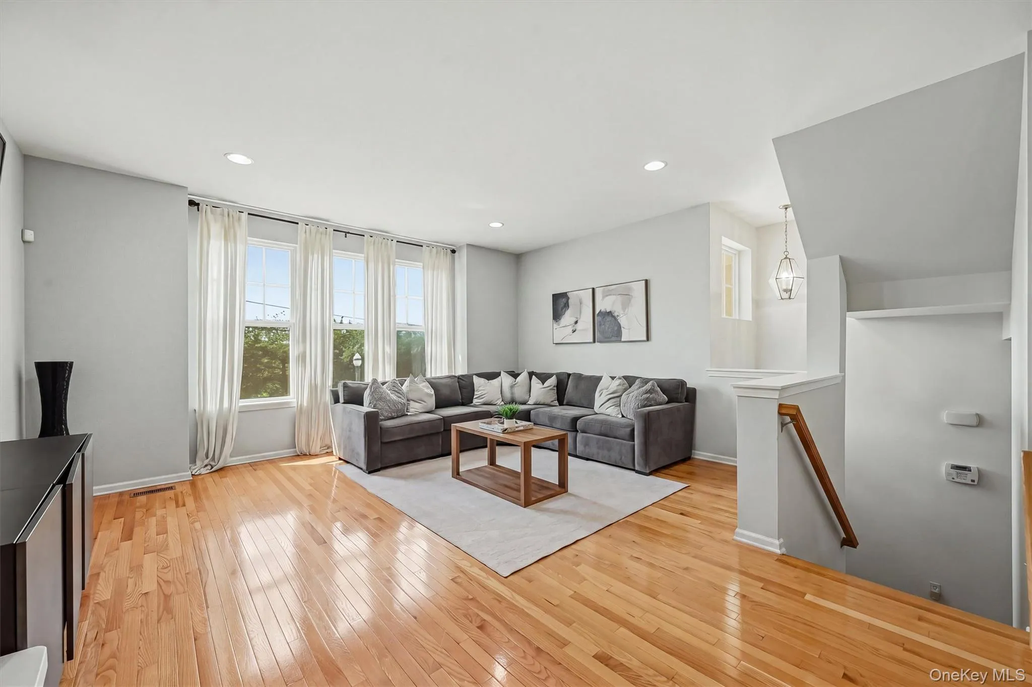 Open Concept Living Room wit Large Windows Open Concept Living Room wit Large Windows