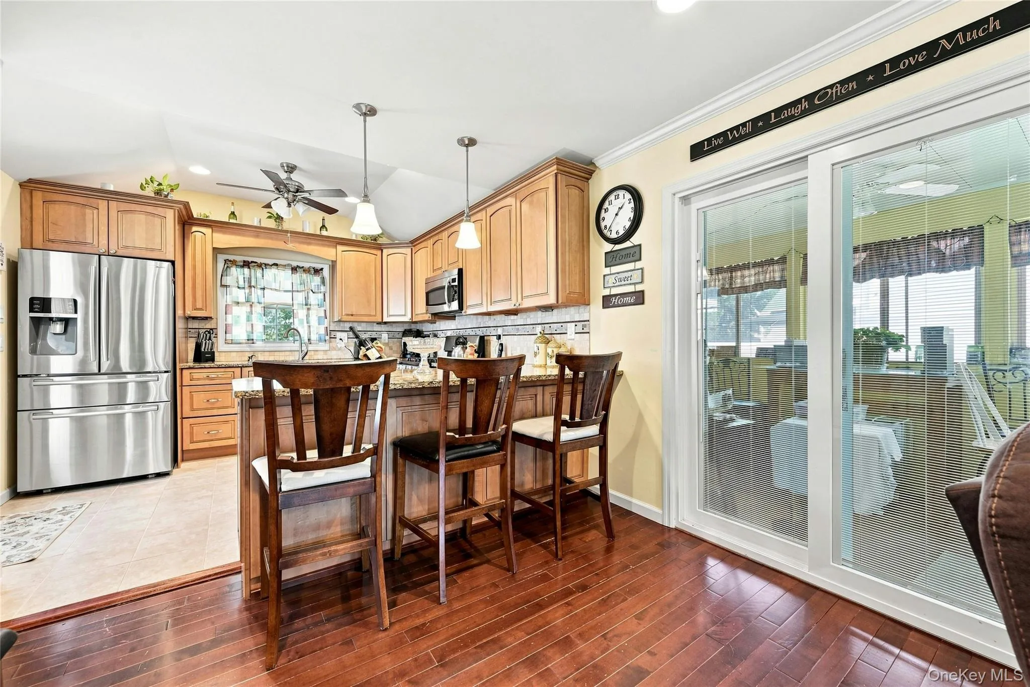 Kitchen & Sliding Doors Into The Sunroom/Screened Porch. Kitchen & Sliding Doors Into The Sunroom/Screened Porch.