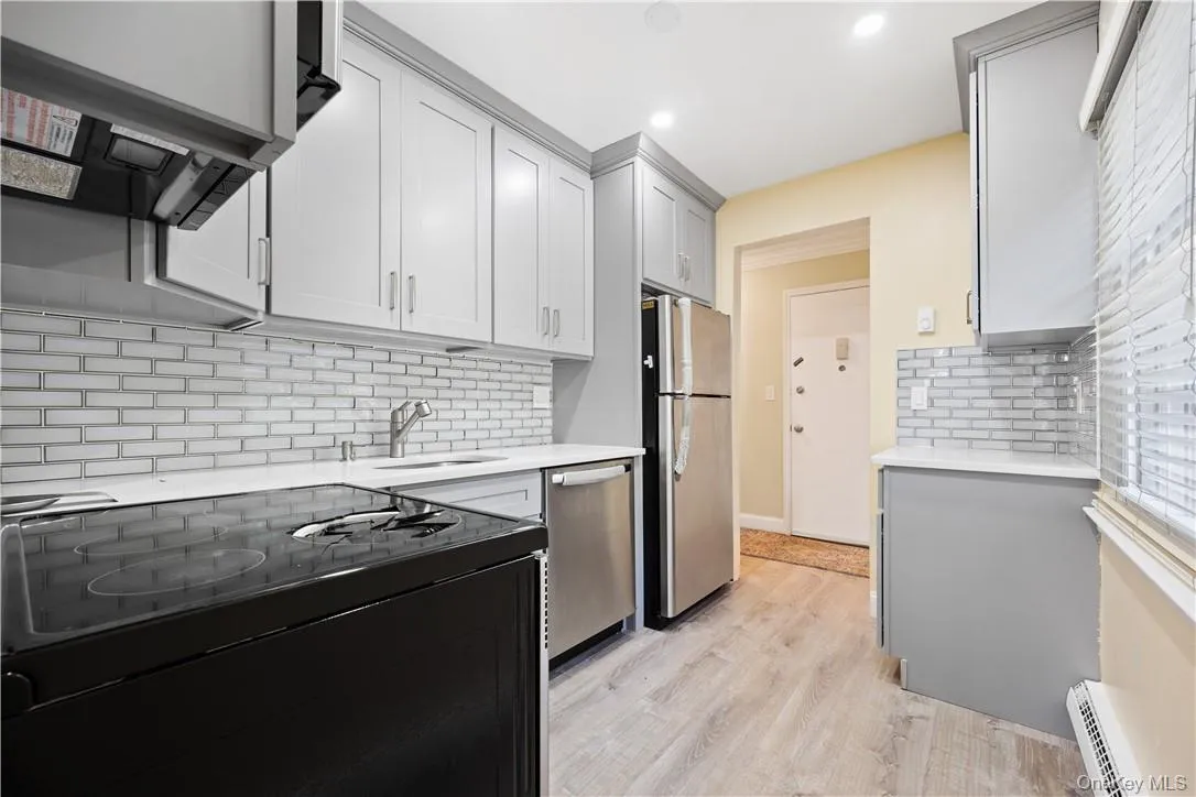 Kitchen has stainless steel appliances. Kitchen has stainless steel appliances.