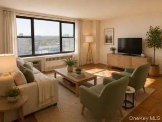 Expansive window offering abundant natural light, wood-finish flooring, and light-toned walls Expansive window offering abundant natural light, wood-finish flooring, and light-toned walls