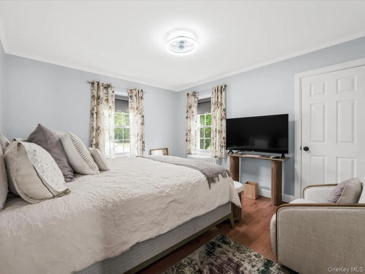 Bright and spacious bedroom with hardwood floors and plenty of natural light. Bright and spacious bedroom with hardwood floors and plenty of natural light.