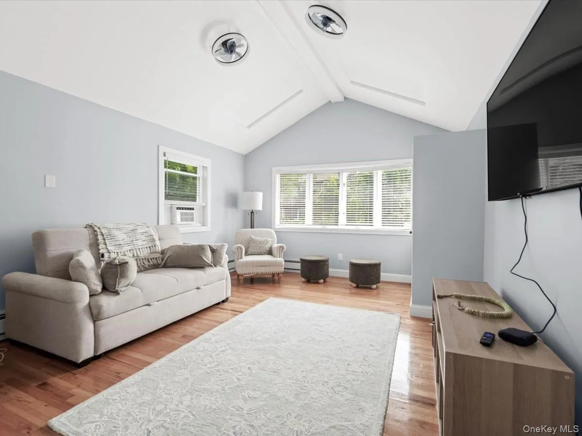 Bright and inviting with vaulted ceilings, exposed beams, hardwood floors, and plenty of natural light. Bright and inviting with vaulted ceilings, exposed beams, hardwood floors, and plenty of natural light.