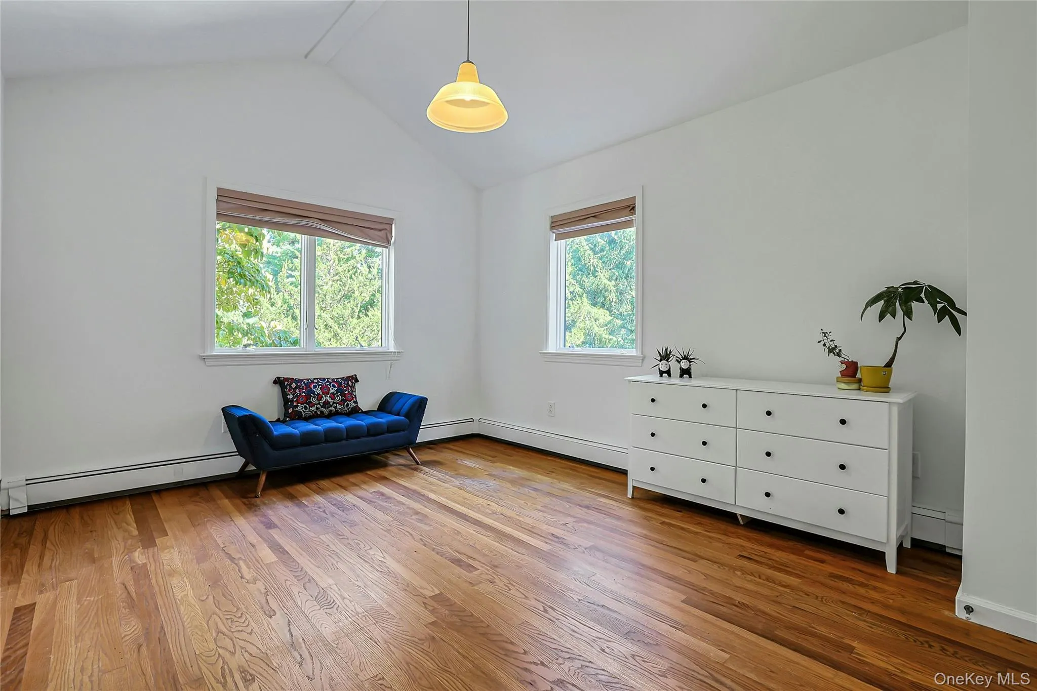 The large third bedroom also features windows overlooking the property, bringing in natural light The large third bedroom also features windows overlooking the property, bringing in natural light