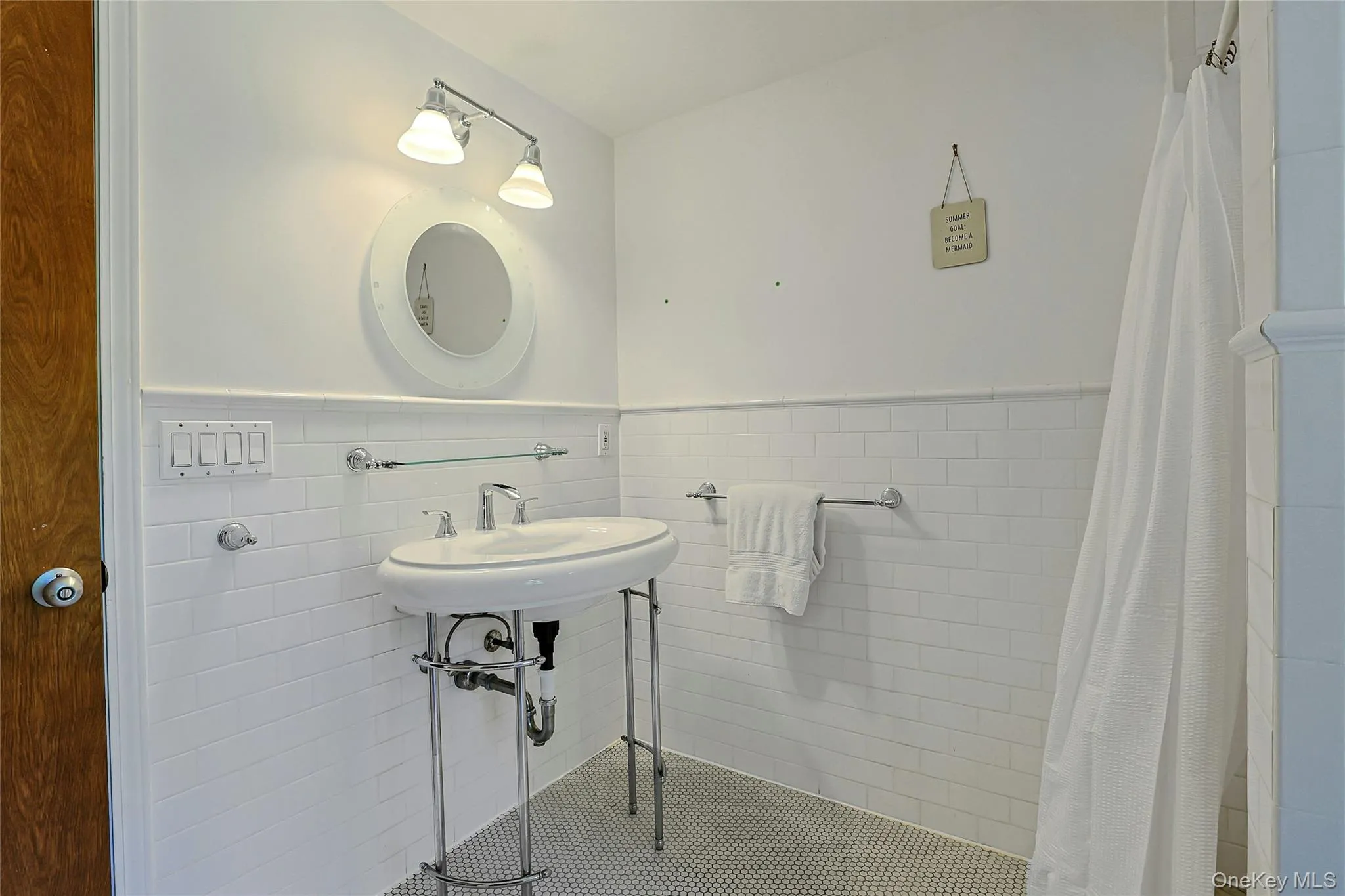 Spacious primary bathroom has clean, timeless look. Spacious primary bathroom has clean, timeless look.