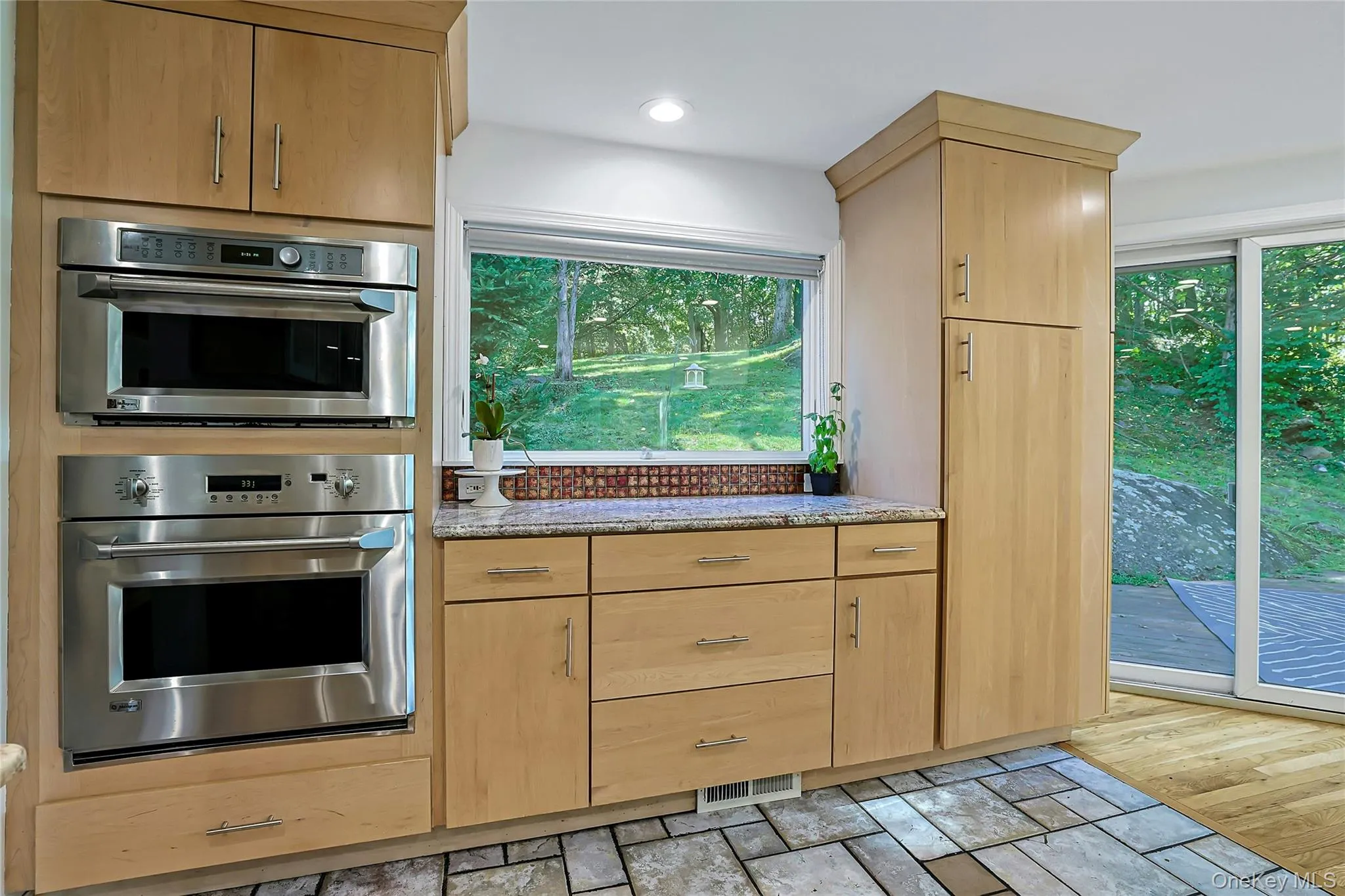 Stainless steel appliances and generous counter space make the kitchen both polished and practical, with plenty of room for prep, serving, and everyday use. Stainless steel appliances and generous counter space make the kitchen both polished and practical, with plenty of room for prep, serving, and everyday use.