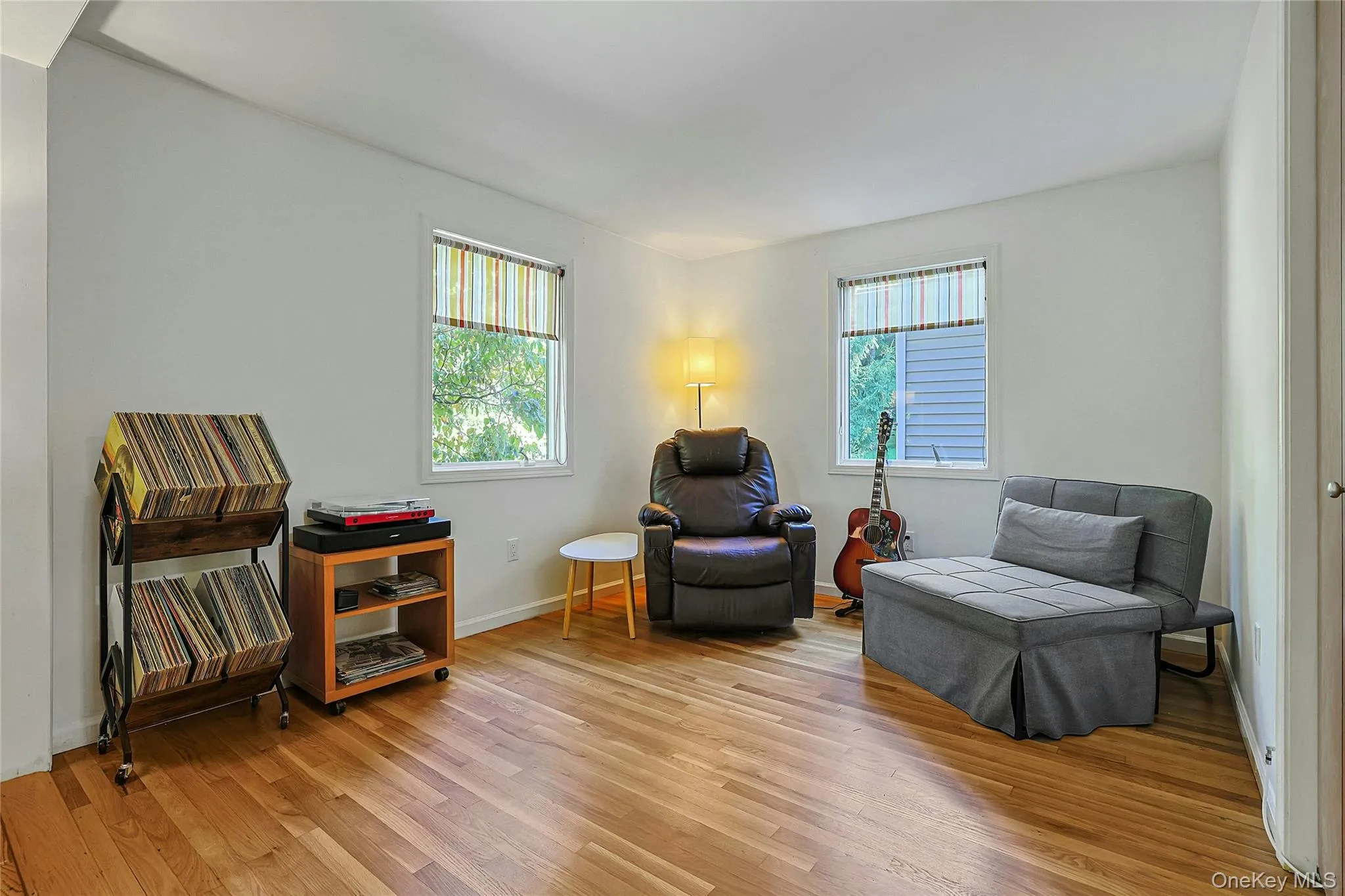 First-floor bedroom currently used as a den, offering flexible space for guests, a home office, or additional everyday living. First-floor bedroom currently used as a den, offering flexible space for guests, a home office, or additional everyday living.