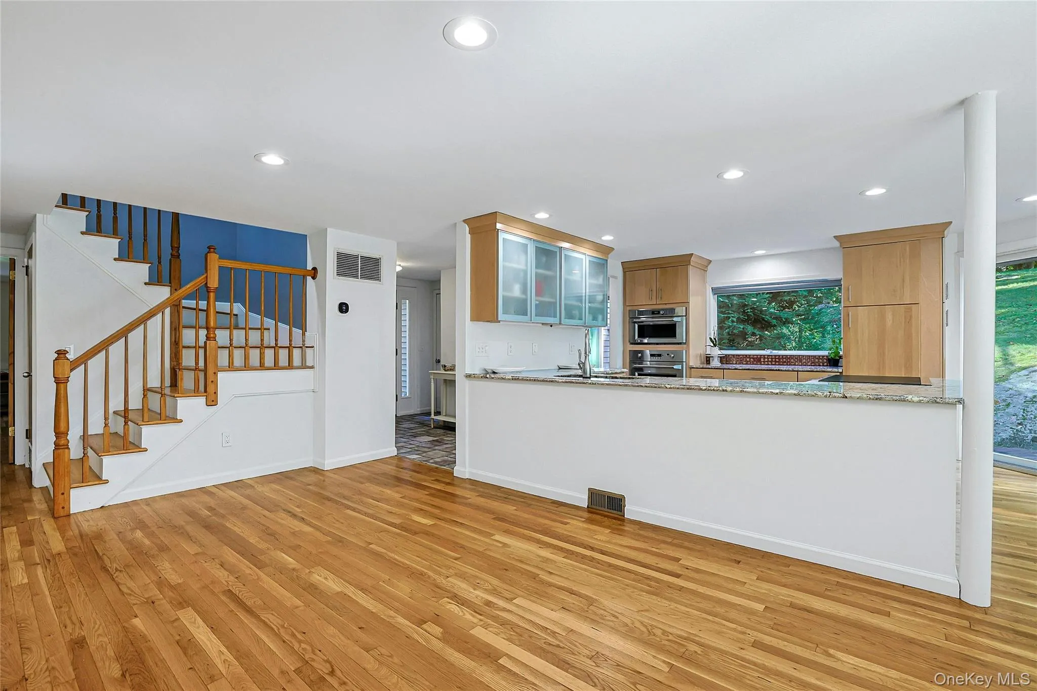 Generous space in front of the kitchen offers room for additional counter stools, creating extra seating for casual meals, conversation, or entertaining. Generous space in front of the kitchen offers room for additional counter stools, creating extra seating for casual meals, conversation, or entertaining.