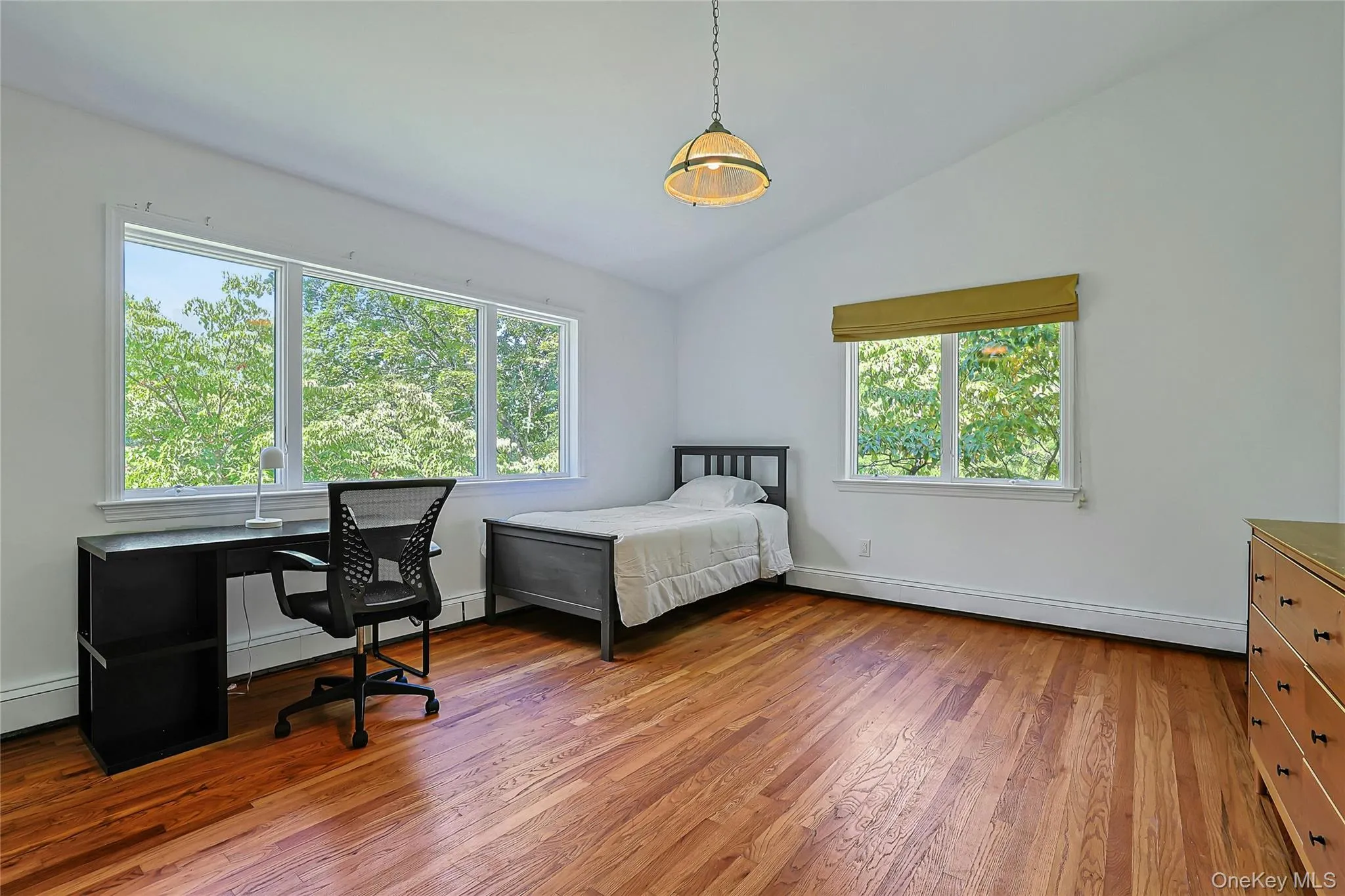 Sun-filled second bedroom offers an inviting space with a fresh, airy feel. Sun-filled second bedroom offers an inviting space with a fresh, airy feel.