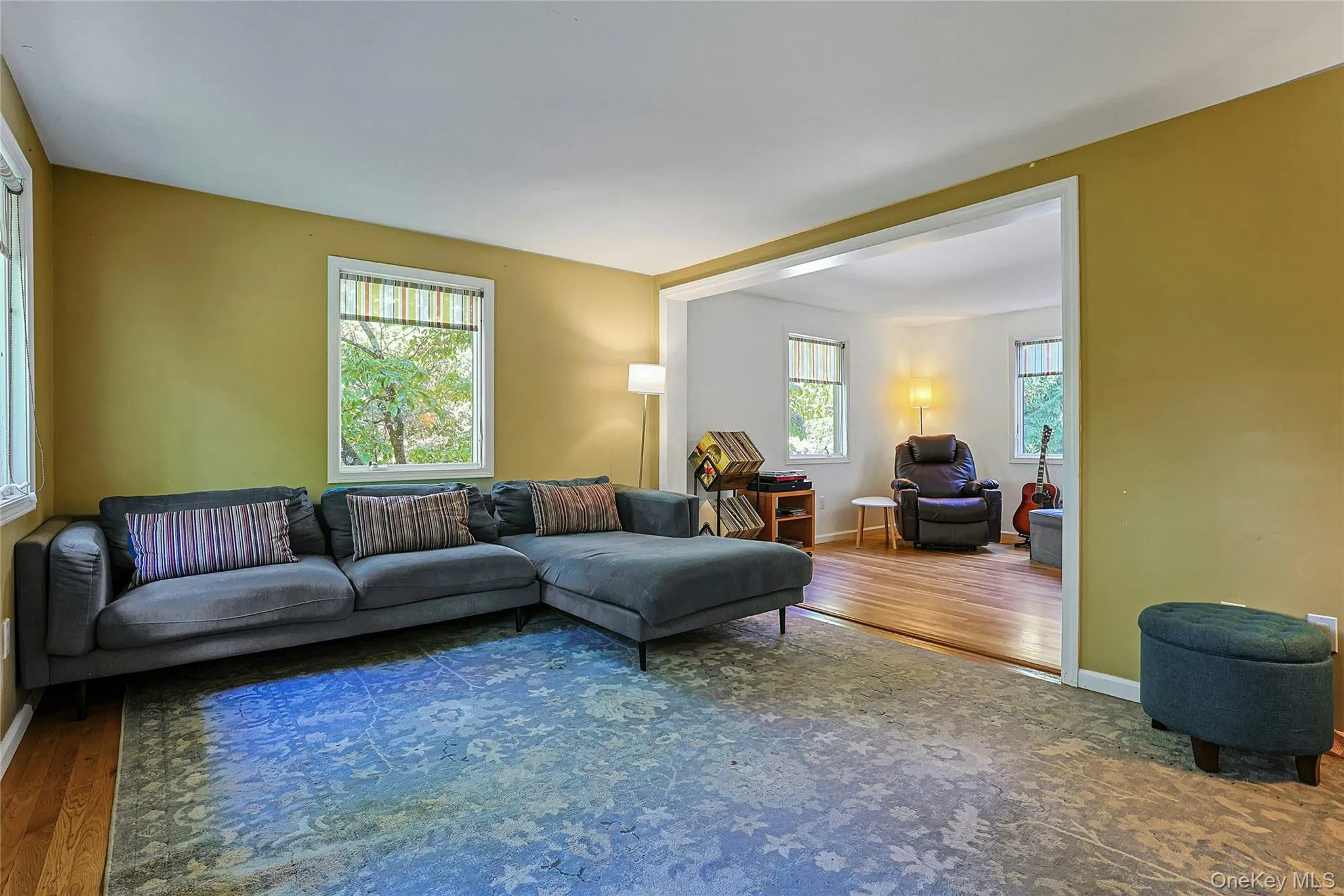 Family room flows into the adjoining bedroom, creating additional space for relaxing, working, or gathering with family and friends Family room flows into the adjoining bedroom, creating additional space for relaxing, working, or gathering with family and friends