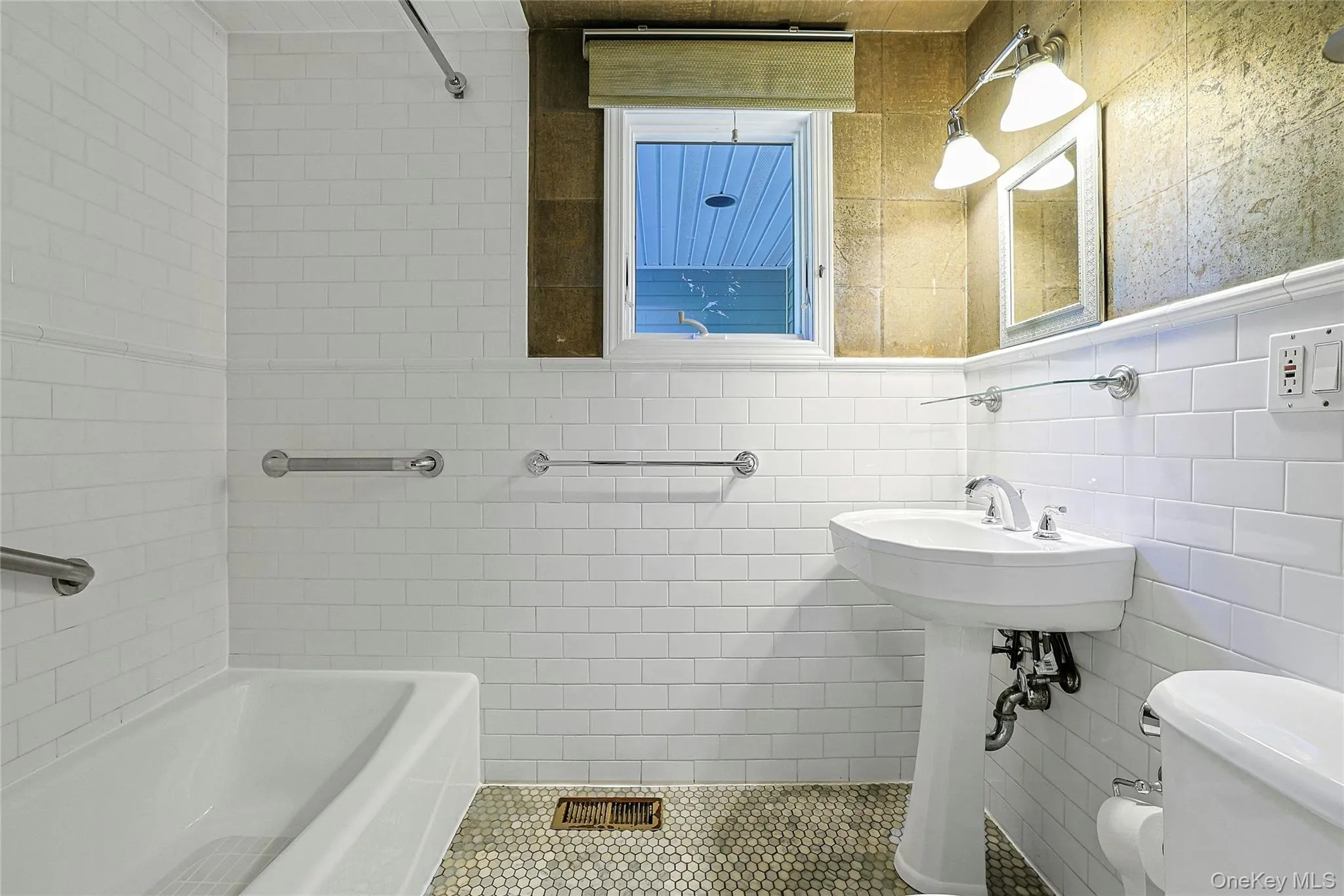 Crisp white first-floor full bathroom offers a clean, bright look and added convenience for guests and everyday living. Crisp white first-floor full bathroom offers a clean, bright look and added convenience for guests and everyday living.