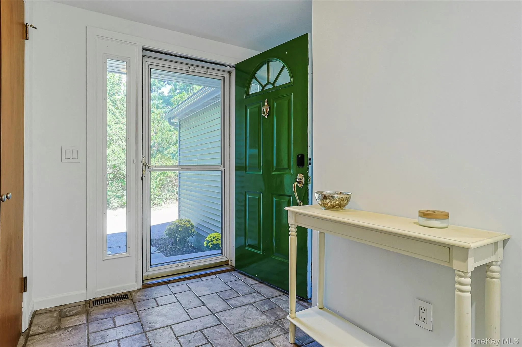 Bright, welcoming entry filled with natural light creates a warm first impression and offers an inviting introduction to the home. Bright, welcoming entry filled with natural light creates a warm first impression and offers an inviting introduction to the home.