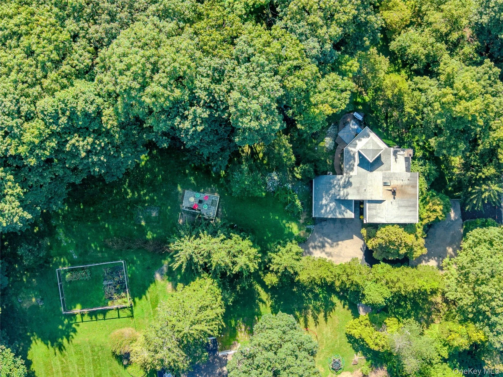Aerial view captures the expansive property and generous backyard, offering a wonderful sense of space, privacy, and the surrounding setting. Aerial view captures the expansive property and generous backyard, offering a wonderful sense of space, privacy, and the surrounding setting.