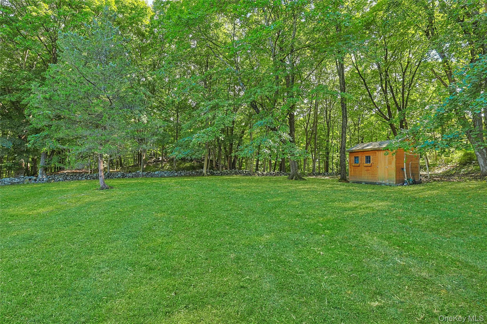 Large backyard offers plenty of room to relax, entertain, garden, or simply enjoy the outdoor setting. Large backyard offers plenty of room to relax, entertain, garden, or simply enjoy the outdoor setting.