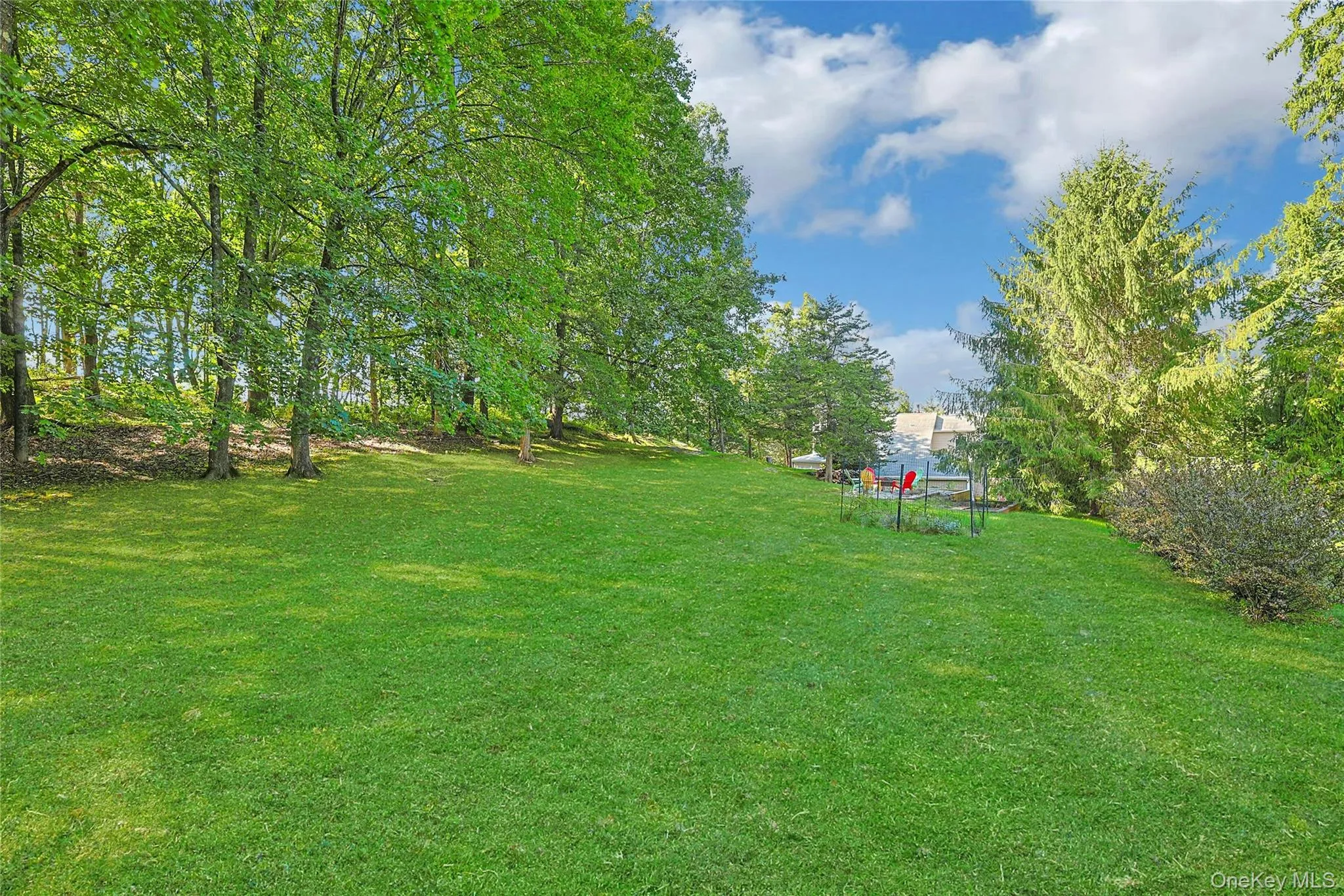 Long, expansive yard offers an impressive stretch of open space, creating plenty of room to enjoy the property and its peaceful surroundings. Long, expansive yard offers an impressive stretch of open space, creating plenty of room to enjoy the property and its peaceful surroundings.