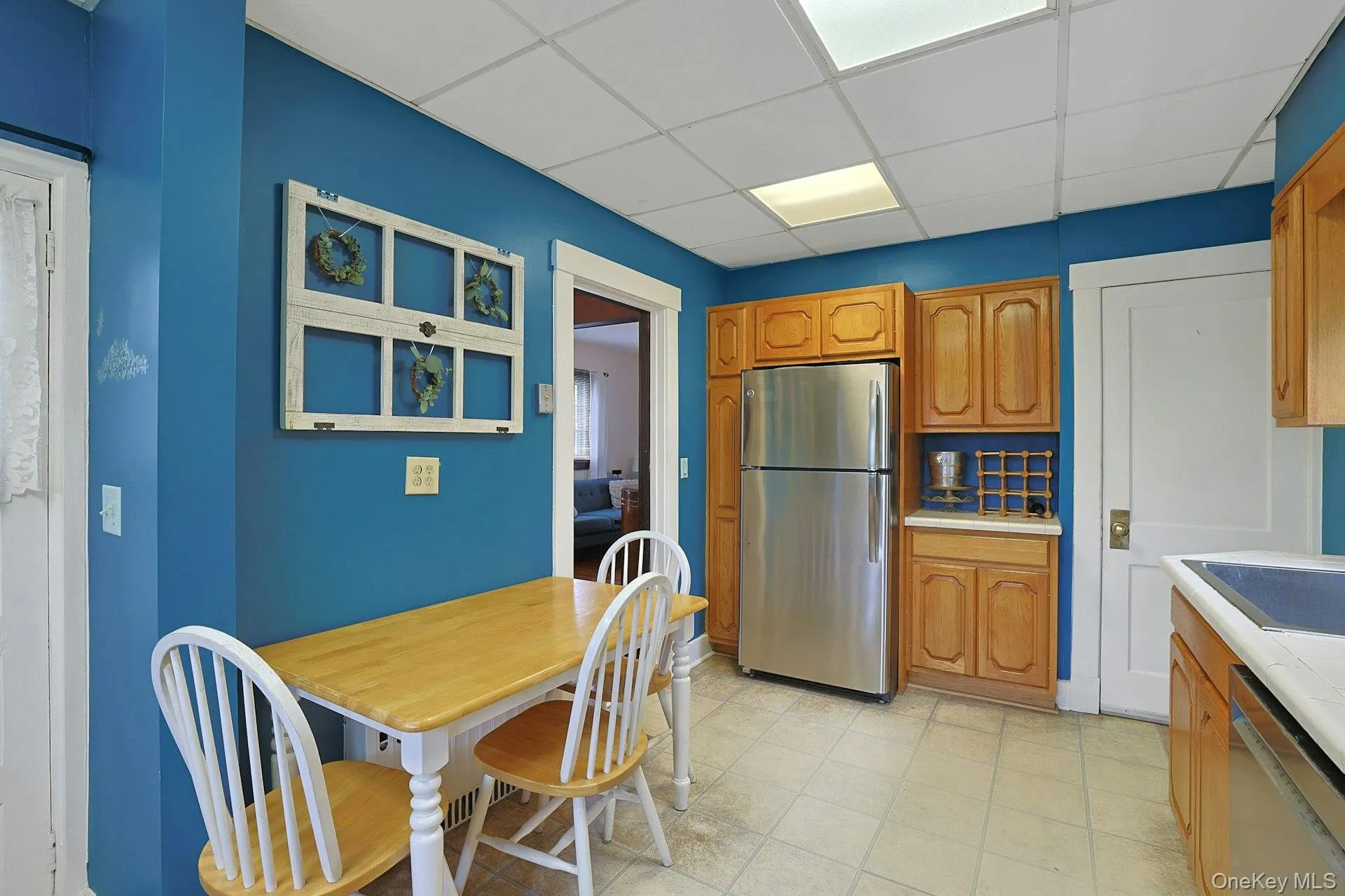 Kitchen opens directly to the dining. The other door leads to stairs to the basement and laundry. Kitchen opens directly to the dining. The other door leads to stairs to the basement and laundry.