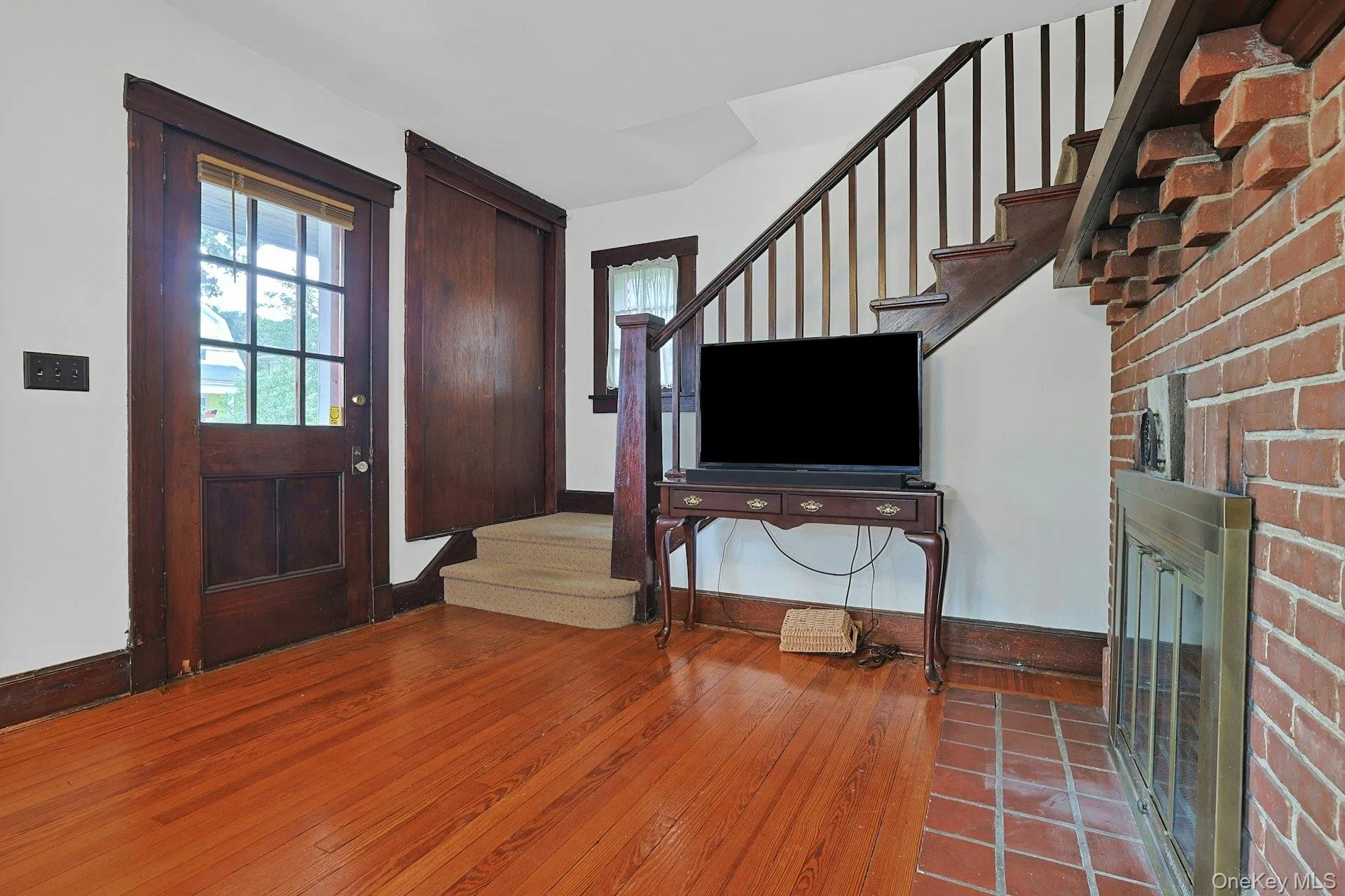 Rich woodwork along the staircase adds character and timeless detail as you head upstairs. Rich woodwork along the staircase adds character and timeless detail as you head upstairs.